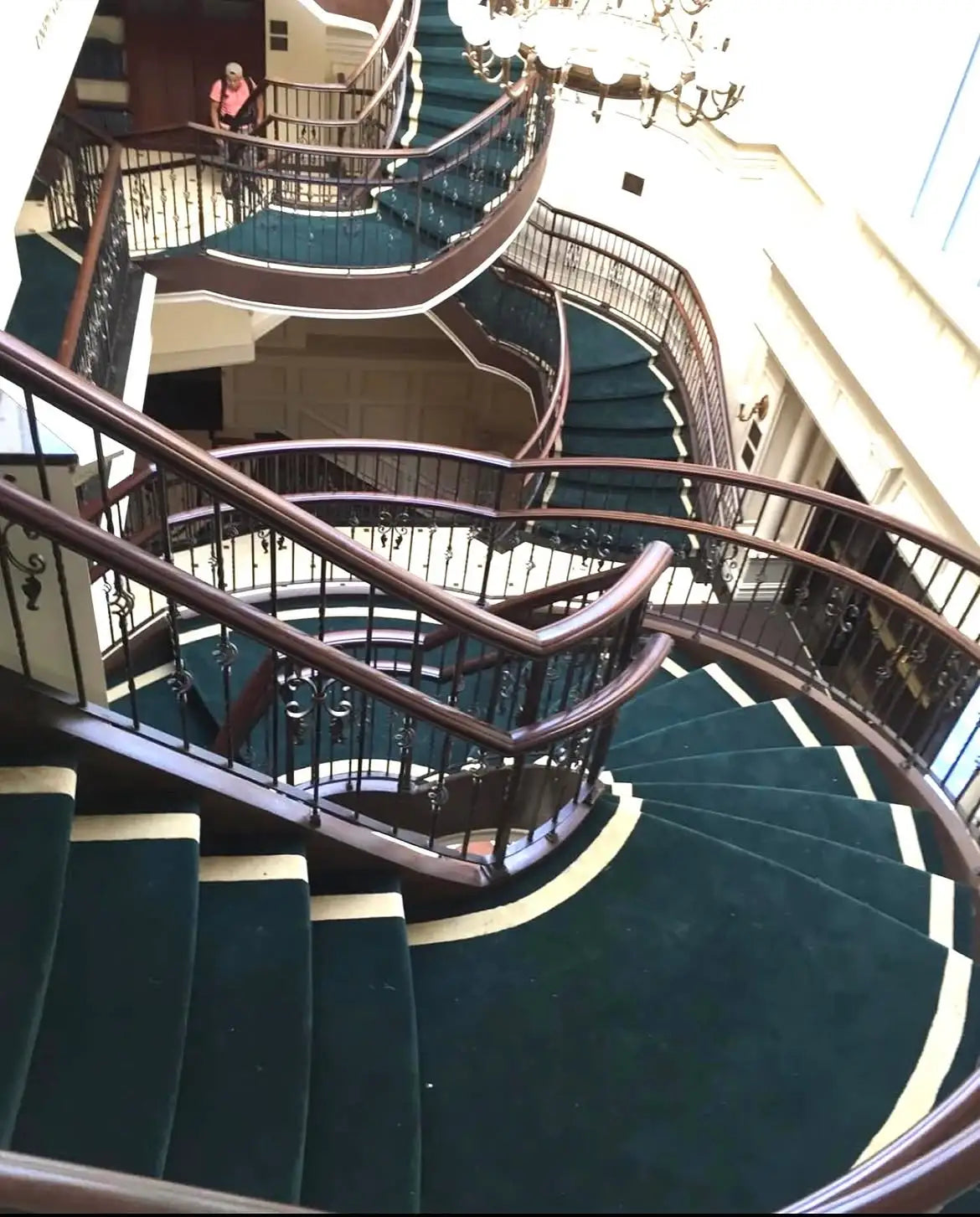 Luxury curved stair runner installation for a grand staircase in a New York City residence.