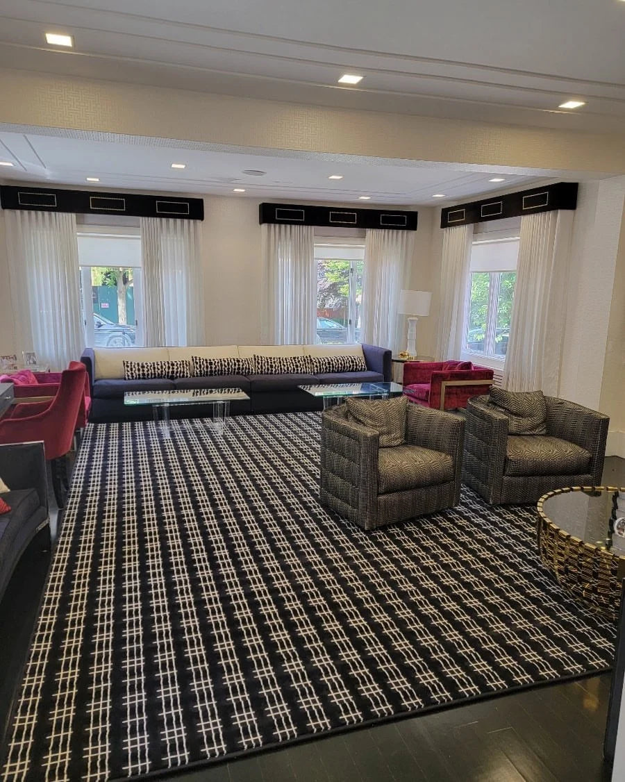 Custom black and white area rug in a modern New Jersey living room designed by Weinstein by STARK.