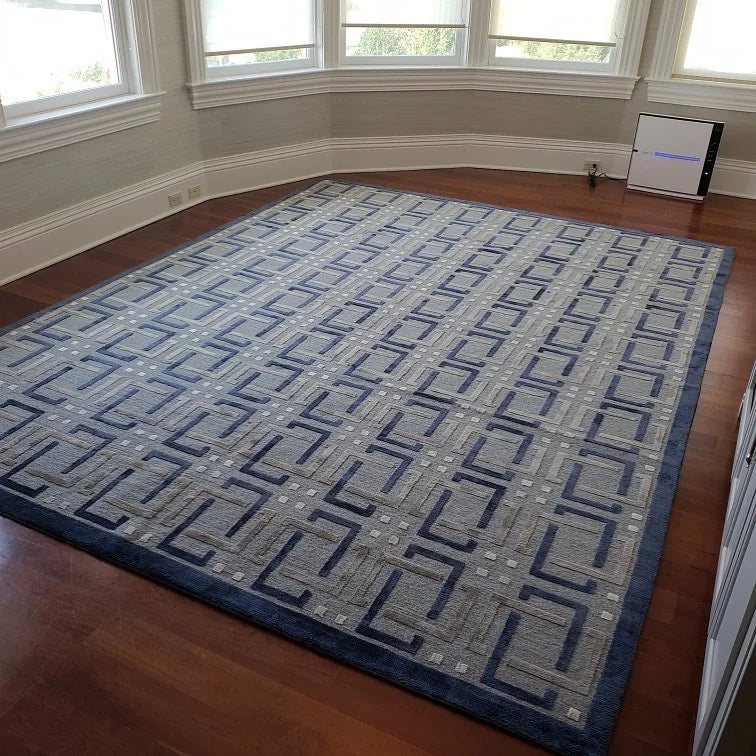 Made-to-order blue geometric custom area rug installed in a spacious New Jersey home.