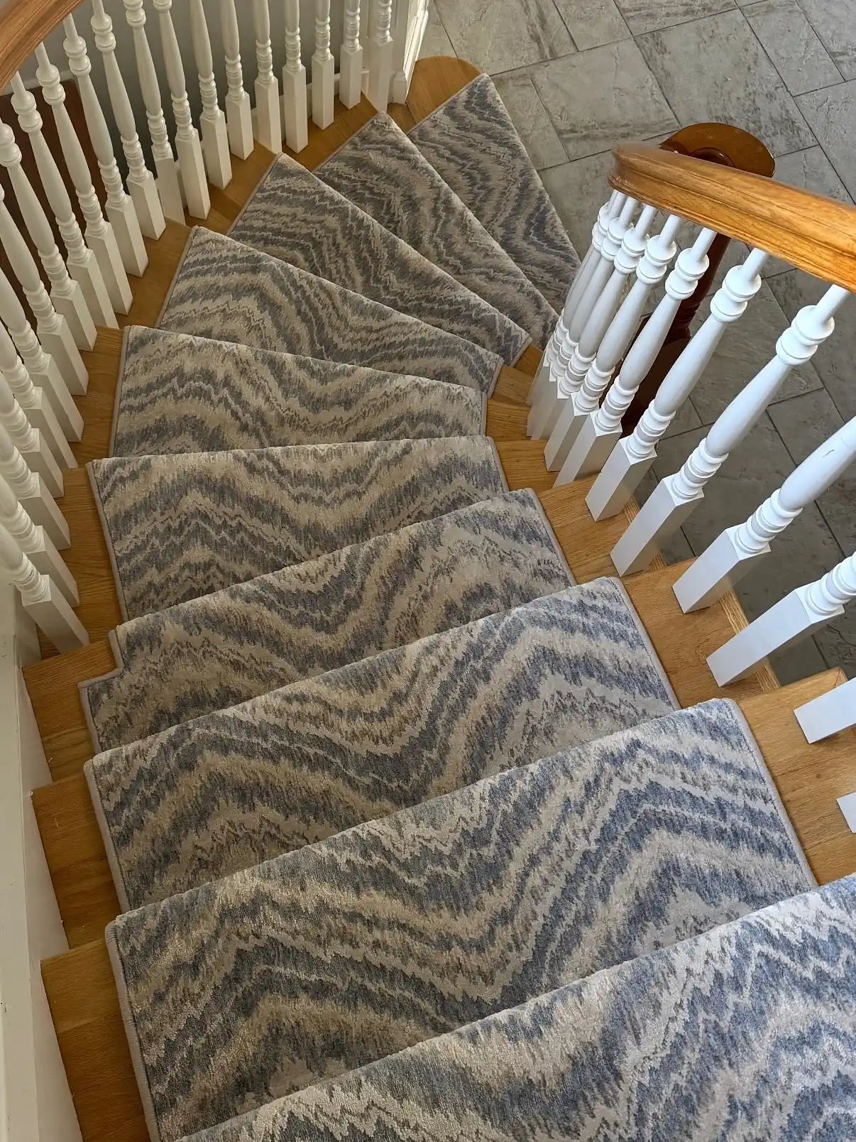 Custom stair runner installed along a multi-level staircase.