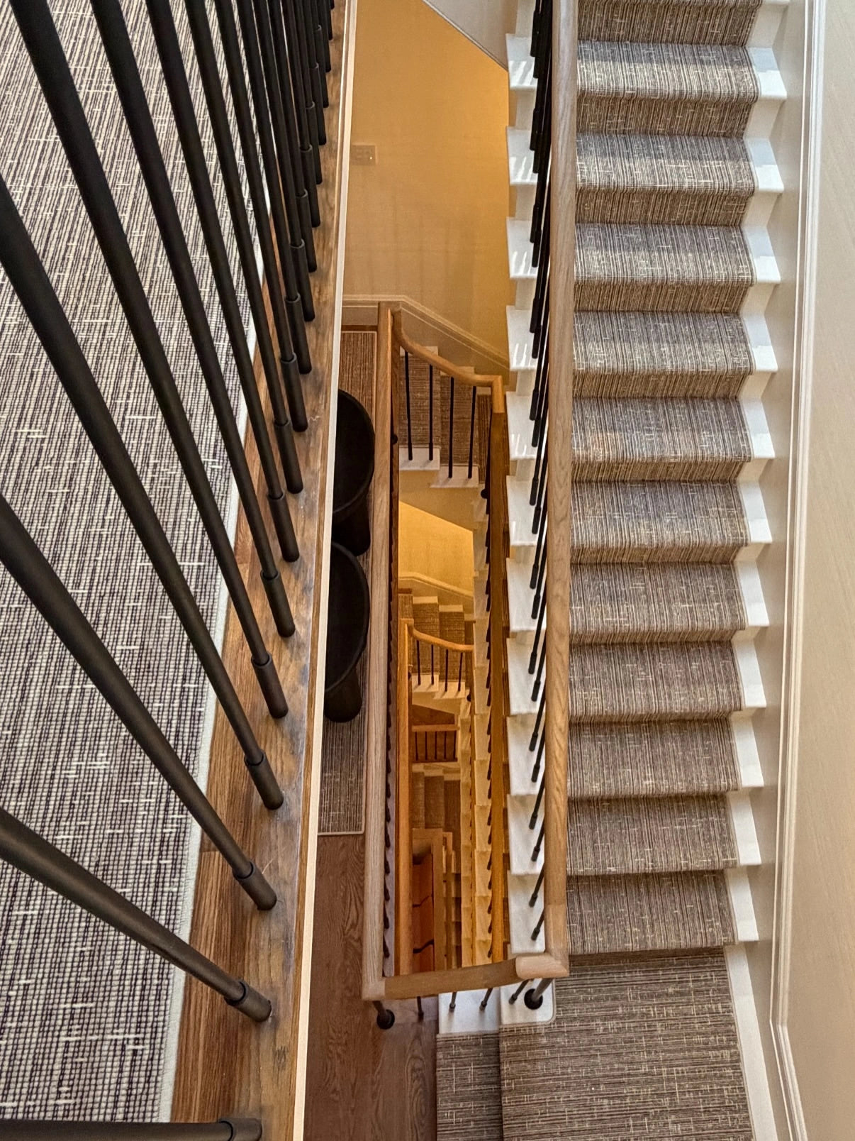 Custom woven stair runner with a neutral textured pattern.