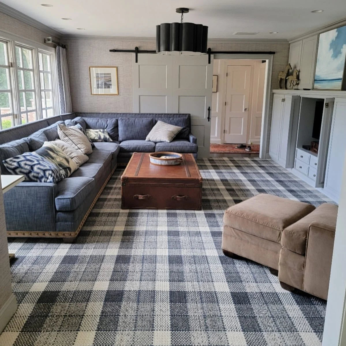 Luxury plaid carpet in a stylish living room with blue and gray furnishings