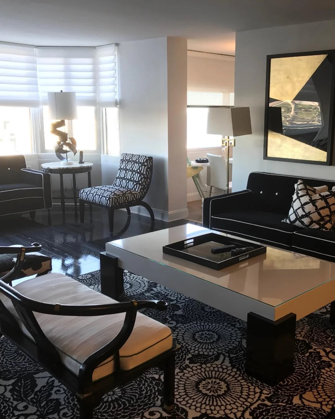 Modern living room featuring a black and white luxury area rug with contemporary furniture and elegant interior design by Weinstein by STARK