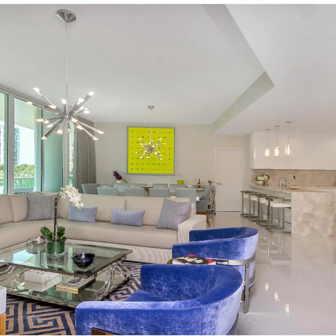 Modern open-concept living room featuring a blue geometric designer area rug by Weinstein by STARK serving Monmouth County, NJ