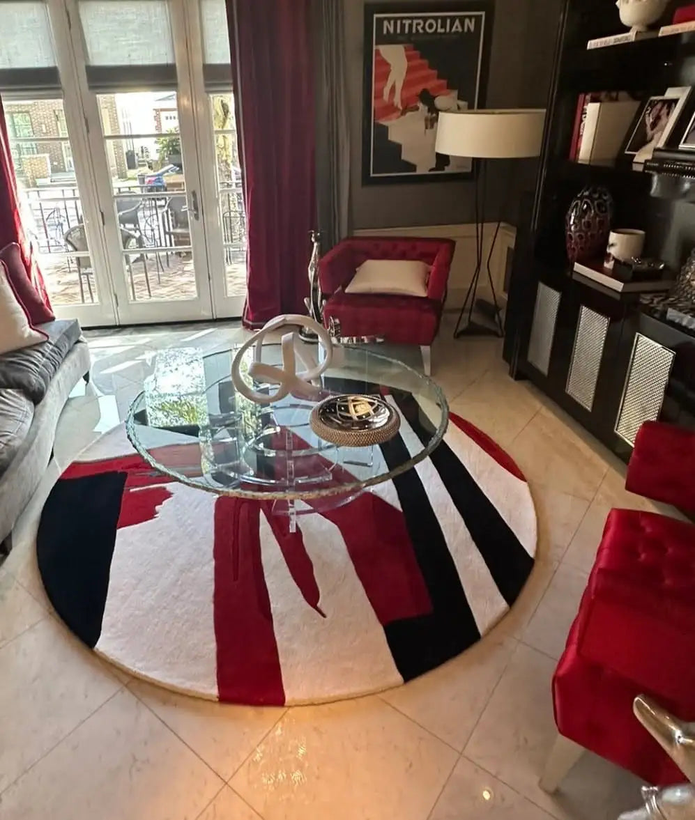Round custom area rug with a bold modern design in a luxury living room.