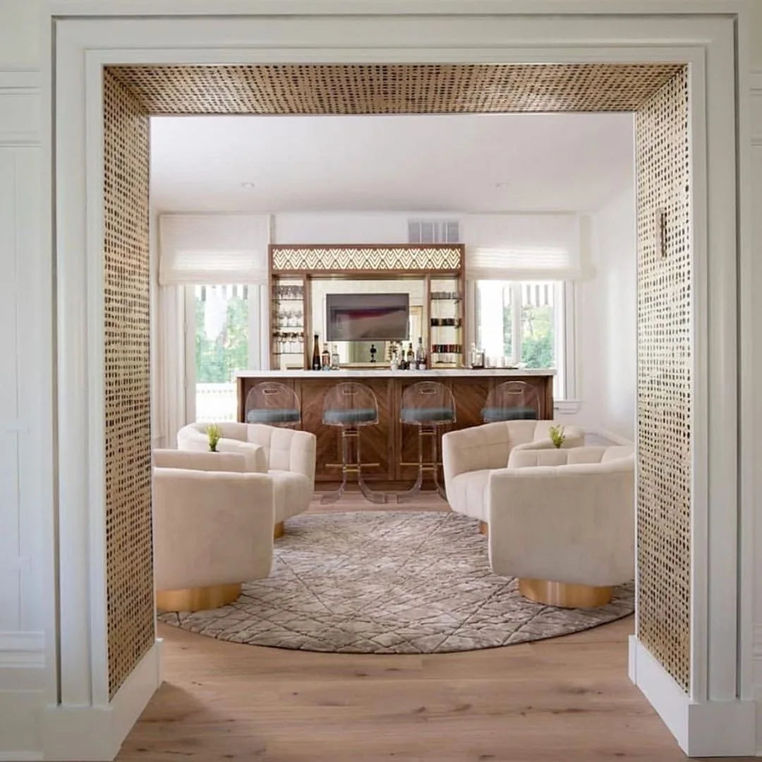 Round neutral custom area rug creating a welcoming seating area in a luxury home.